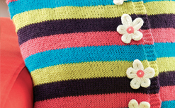 Multi-coloured striped flower cushion