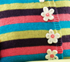 Multi-coloured striped flower cushion
