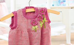 Girl’s knitted pinafore dress