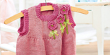 Girl’s knitted pinafore dress